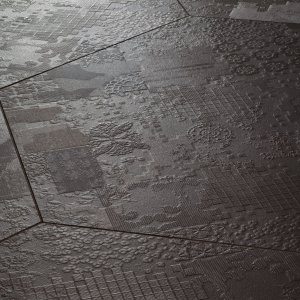 Sol en grès Déchirer de Mutina au bas-relief effet béton