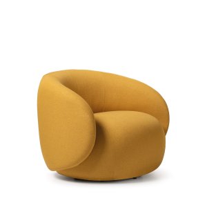 Pouf Hill de Quinti, 40 cm de haut, posé devant le fauteuil