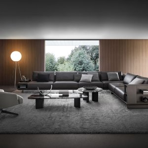 Canapé modulable Asso d’i4Mariani avec base en cuir et volumes en tissu